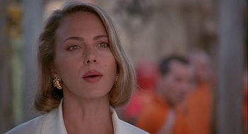 Movie still from “Hot Shots! Part Deux” (1993), directed by Jim Abrahams – A person wearing a white shirt; Close Up shot, Low angle