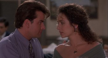 Movie still from “Hot Shots! Part Deux” (1993), directed by Jim Abrahams – A man and a woman face to face in front of a mirror; Close Up shot, Over the shoulder angle