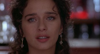 Movie still from “Hot Shots! Part Deux” (1993), directed by Jim Abrahams – A woman's face with blue eyes; Close Up shot, Over the shoulder angle