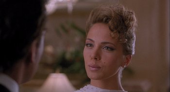 Movie still from “Hot Shots! Part Deux” (1993), directed by Jim Abrahams – A person wearing a white dress; Close Up shot, Over the shoulder angle
