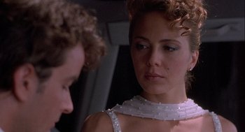 Movie still from “Hot Shots! Part Deux” (1993), directed by Jim Abrahams – A man and a woman are looking at one another; Close Up shot, Over the shoulder angle