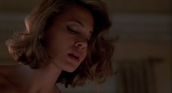 Movie still from “Hot Shots! Part Deux” (1993), directed by Jim Abrahams – A person with long brown hair; Close Up shot, Low angle