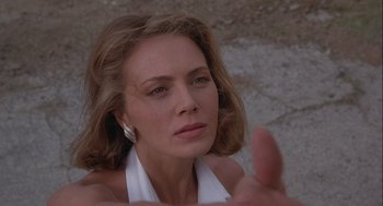Movie still from “Hot Shots! Part Deux” (1993), directed by Jim Abrahams – A person wearing a white shirt; Close Up shot, Low angle