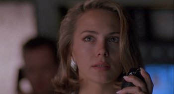 Movie still from “Hot Shots! Part Deux” (1993), directed by Jim Abrahams – A person talking on a cell phone; Close Up shot, Low angle
