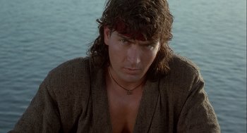 Movie still from “Hot Shots! Part Deux” (1993), directed by Jim Abrahams – A person with long hair; Close Up shot, Low angle