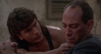 Movie still from “Hot Shots! Part Deux” (1993), directed by Jim Abrahams – A man and a woman sitting next to each other; Close Up shot, Over the shoulder angle