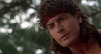 Movie still from “Hot Shots! Part Deux” (1993), directed by Jim Abrahams – A person wearing a headband; Close Up shot, Low angle