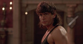 Movie still from “Hot Shots! Part Deux” (1993), directed by Jim Abrahams – A person with long hair; Close Up shot, Low angle