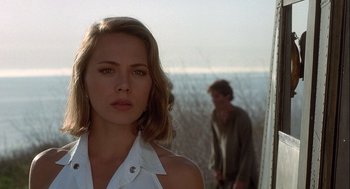 Movie still from “Hot Shots! Part Deux” (1993), directed by Jim Abrahams – A woman standing in front of a man in a field; Close Up shot, Over the shoulder angle