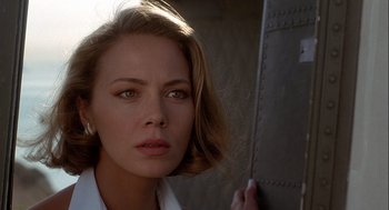 Movie still from “Hot Shots! Part Deux” (1993), directed by Jim Abrahams – A person holding a book; Close Up shot, Low angle