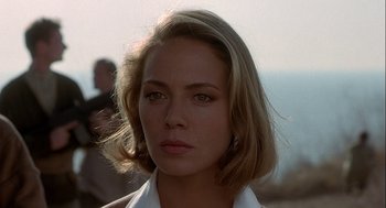 Movie still from “Hot Shots! Part Deux” (1993), directed by Jim Abrahams – A person wearing a white shirt; Close Up shot, Over the shoulder angle