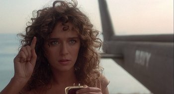 Movie still from “Hot Shots! Part Deux” (1993), directed by Jim Abrahams – A person holding a cell phone; Close Up shot, Over the shoulder angle