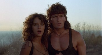 Movie still from “Hot Shots! Part Deux” (1993), directed by Jim Abrahams – A man and a woman standing next to each other; Close Up shot, Low angle