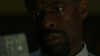Movie still from “Hotel Artemis” (2018), directed by Drew Pearce – A man's face in the dark; Close Up shot, Low angle