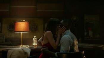 Movie still from “Hotel Artemis” (2018), directed by Drew Pearce – A man and a woman are kissing in a restaurant; Medium shot, High angle