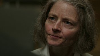 Movie still from “Hotel Artemis” (2018), directed by Drew Pearce – An older woman with long gray hair looking at the camera; Close Up shot, Over the shoulder angle