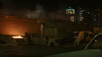 Movie still from “Hotel Artemis” (2018), directed by Drew Pearce – A group of tents pitched on the side of the street; Extreme Wide shot, High angle