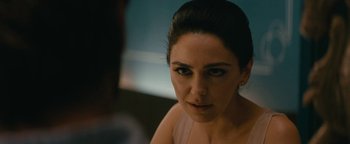 Movie still from “Hotel Mumbai” (2018), directed by Anthony Maras – A woman's face in front of a mirror; Close Up shot, Over the shoulder angle