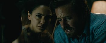 Movie still from “Hotel Mumbai” (2018), directed by Anthony Maras – A man and a woman looking at each other in the dark; Close Up shot, Low angle