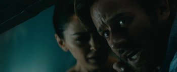 Movie still from “Hotel Mumbai” (2018), directed by Anthony Maras – A man and a woman looking at the camera; Close Up shot, Over the shoulder angle