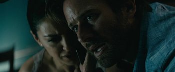 Movie still from “Hotel Mumbai” (2018), directed by Anthony Maras – A man and a woman's face; Close Up shot, Over the shoulder angle