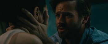 Movie still from “Hotel Mumbai” (2018), directed by Anthony Maras – A person with a beard; Close Up shot, Over the shoulder angle