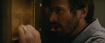 Movie still from “Hotel Mumbai” (2018), directed by Anthony Maras – A person with a beard; Close Up shot, Over the shoulder angle