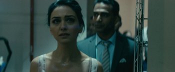 Movie still from “Hotel Mumbai” (2018), directed by Anthony Maras – A man and a woman standing next to each other in a room; Close Up shot, Over the shoulder angle