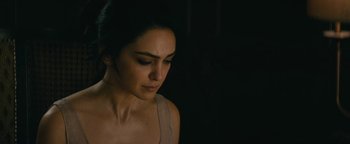 Movie still from “Hotel Mumbai” (2018), directed by Anthony Maras – A woman is looking down at her face; Close Up shot, Over the shoulder angle