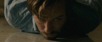 Movie still from “Hotel Mumbai” (2018), directed by Anthony Maras – A person laying on the ground; Extreme Close Up shot, High angle