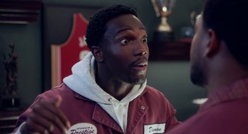 Movie still from “House Party” (2023), directed by Calmatic – A person wearing a jacket; Close Up shot, Over the shoulder angle