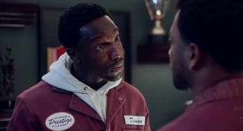 Movie still from “House Party” (2023), directed by Calmatic – A man in a red jacket talking to another man in a red jacket; Close Up shot, Over the shoulder angle