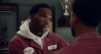 Movie still from “House Party” (2023), directed by Calmatic – A man wearing a red jacket talking to another man; Close Up shot, Over the shoulder angle