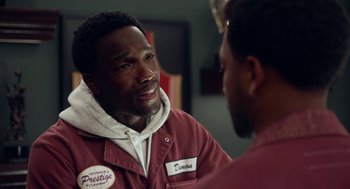 Movie still from “House Party” (2023), directed by Calmatic – A man in a red jacket talking to another man in a red jacket; Close Up shot, Over the shoulder angle