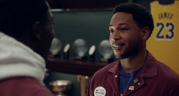 Movie still from “House Party” (2023), directed by Calmatic – A man in a red jacket talking to another man in a blue shirt; Close Up shot, Over the shoulder angle