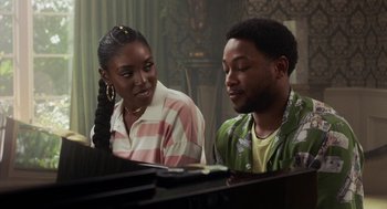 Movie still from “House Party” (2023), directed by Calmatic – A man and a woman sitting next to each other at a piano; Close Up shot, Over the shoulder angle