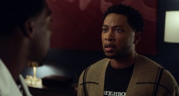 Movie still from “House Party” (2023), directed by Calmatic – A man in a brown jacket is looking at a man in a black shirt; Close Up shot, Over the shoulder angle