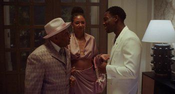 Movie still from “House Party” (2023), directed by Calmatic – Two men and a woman are talking to each other; Medium shot, Over the shoulder angle