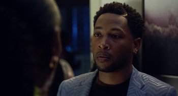 Movie still from “House Party” (2023), directed by Calmatic – A person wearing a jacket; Close Up shot, Over the shoulder angle