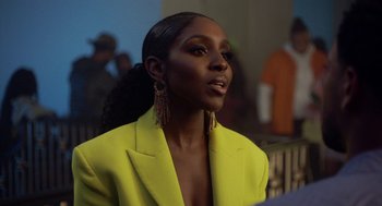 Movie still from “House Party” (2023), directed by Calmatic – A person wearing a yellow jacket; Close Up shot, Over the shoulder angle