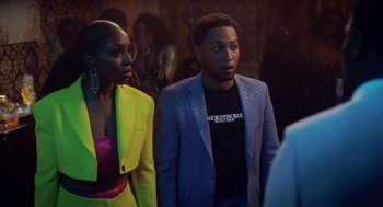 Movie still from “House Party” (2023), directed by Calmatic – A man and a woman standing next to each other; Medium shot, Over the shoulder angle