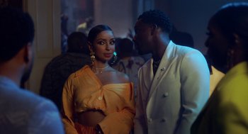 Movie still from “House Party” (2023), directed by Calmatic – A man and a woman standing next to each other; Medium shot, Over the shoulder angle