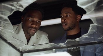 Movie still from “House Party” (2023), directed by Calmatic – Two men are looking at each other through a window; Close Up shot, Low angle