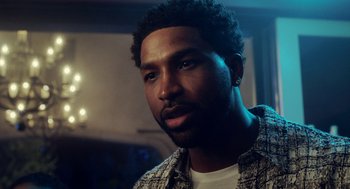 Movie still from “House Party” (2023), directed by Calmatic – A person with a beard; Close Up shot, Over the shoulder angle