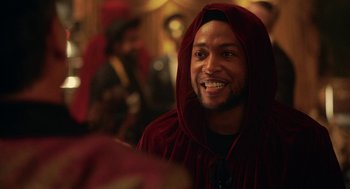 Movie still from “House Party” (2023), directed by Calmatic – A person wearing a hooded jacket; Close Up shot, Over the shoulder angle