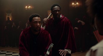 Movie still from “House Party” (2023), directed by Calmatic – A couple of men standing next to each other; Medium shot, Over the shoulder angle