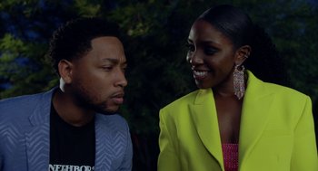 Movie still from “House Party” (2023), directed by Calmatic – A man and a woman standing next to each other in front of a tree; Close Up shot, Over the shoulder angle