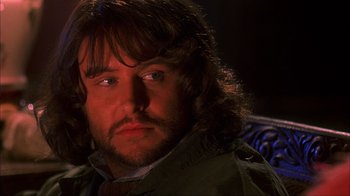 Movie still from “House of 1000 Corpses” (2003), directed by Rob Zombie – A person with long hair; Close Up shot, Over the shoulder angle