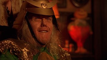 Movie still from “House of 1000 Corpses” (2003), directed by Rob Zombie – A person wearing a hat; Close Up shot, Low angle