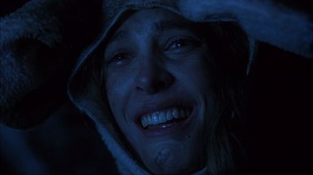 Movie still from “House of 1000 Corpses” (2003), directed by Rob Zombie – A person with a hood on; Close Up shot, Low angle